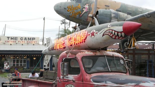 BANGKOK, THAILAND - 10 JULY, 2019: The camp vintage flea market near Chatuchak. Modern design of retro style boutique art shop of old antiques. Decoration of popular strange fashion city landmark