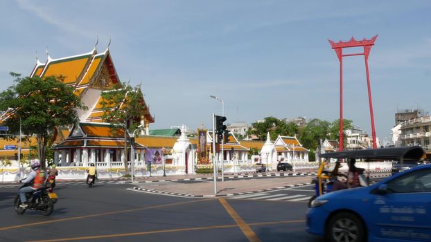 BANGKOK, THAILAND - 11 JULY, 2019: Giant Swing religios historic monument near traditional wat Suthat buddist temple. Iconic city view, cultural symbol. Famous landmark and classic tourist attraction