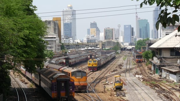 BANGKOK, THAILAND - 11 JULY, 2019: View of the train station against the backdrop of the cityscape and skyscrapers. Hua Lamphong is the hub of public transportation. State railway transport in Siam