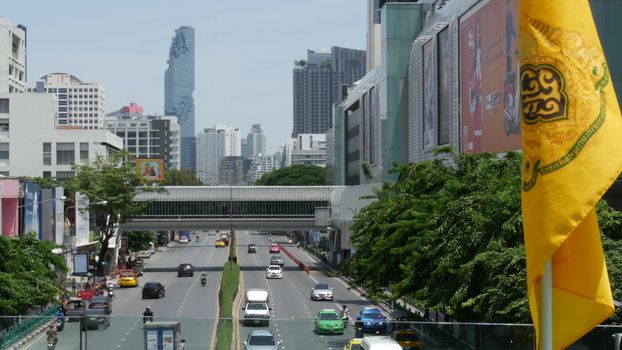 BANGKOK, THAILAND - 13 JULY, 2019: Mahanakhon King Power skyscraper in modern Sathorn financial business district. Maha Nakhon - tallest futuristic building. Rush hour traffic, cars and bts skytrain.