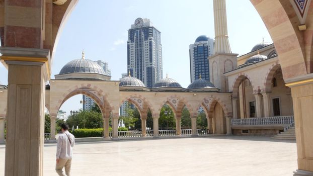 GROZNY, THE CHECHEN REPUBLIC OF ICHKERIA, CAUCASUS, RUSSIA - 6 SEPTEMBER 2019: Day of Civil Concord and Unity celebration in capital near The Heart of Chechnya. People on square near islamic mosque