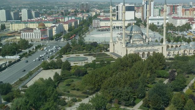 GROZNY, THE CHECHEN REPUBLIC OF ICHKERIA, CAUCASUS, RUSSIA - 6 SEPTEMBER 2019: Day of Civil Concord and Unity celebration in capital near The Heart of Chechnya. People on square near islamic mosque