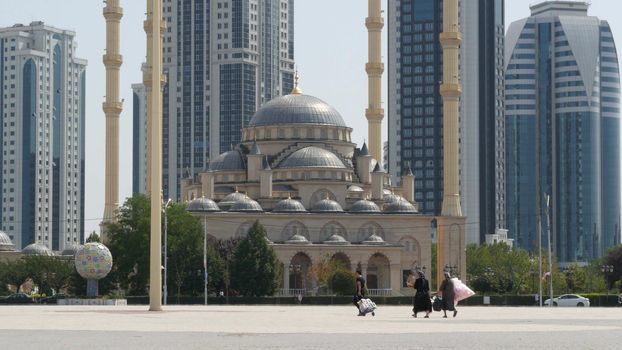 GROZNY, THE CHECHEN REPUBLIC OF ICHKERIA, CAUCASUS, RUSSIA - 6 SEPTEMBER 2019: Day of Civil Concord and Unity celebration in capital near The Heart of Chechnya. People on square near islamic mosque