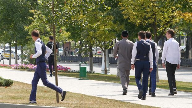 GROZNY, THE CHECHEN REPUBLIC OF ICHKERIA, CAUCASUS, RUSSIA - 6 SEPTEMBER 2019: Day of Civil Concord and Unity celebration, capital, The Heart of Chechnya. Happy cheerful young muslim people on square