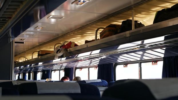 LOS ANGELES, CALIFORNIA, USA - 24 OCT 2019: Amtrak Pacific Surfliner commuter, express train car inside. Passenger rapid rail transportation along the ocean. Railway on west coast. Railroad in suburb.