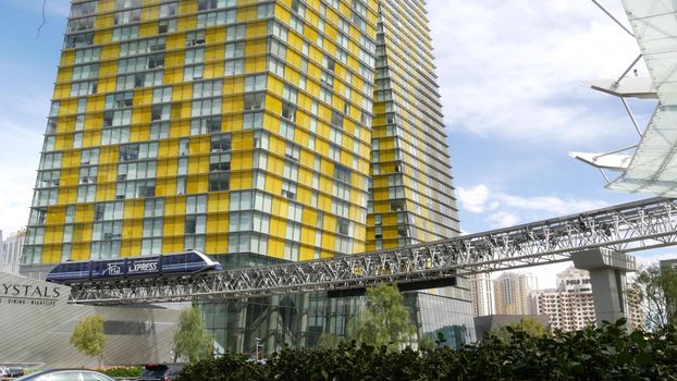 LAS VEGAS, NEVADA USA - 7 MAR 2020: Futuristic CityCenter casino complex in sin city. Modern luxury unincorporated urban skyline. Contemporary metropolis highrise skyscraper and monorail express train