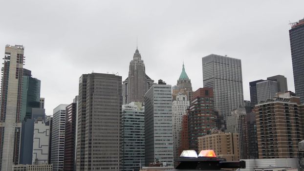 NEW YORK CITY, USA - 12 MAR 2020: Emergency siren glowing, 991 police patrol car on Brooklyn bridge. NYPD auto, symbol of crime prevention and safety in Manhattan. Metropolis security and protection.