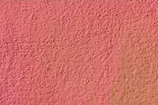 Texture background in pastel pink with a non-uniform surface