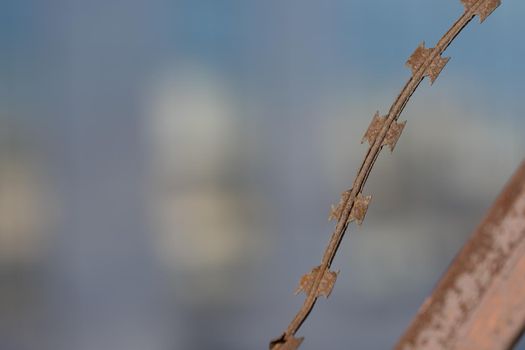 Blurred background with rusty metal wire. For design and networking.