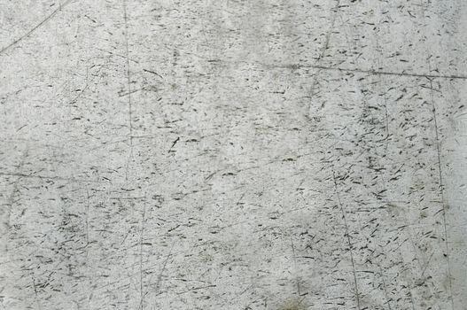 The old concrete wall is gray with scratches on the surface of the close-up.Texture or background
