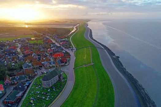 Aerial from the village Wierum in the Netherlands at sunset near the Waddenzee