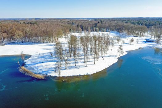 Aerial from a dutch landscape naer lake Bussloo in winter in the Netherlands