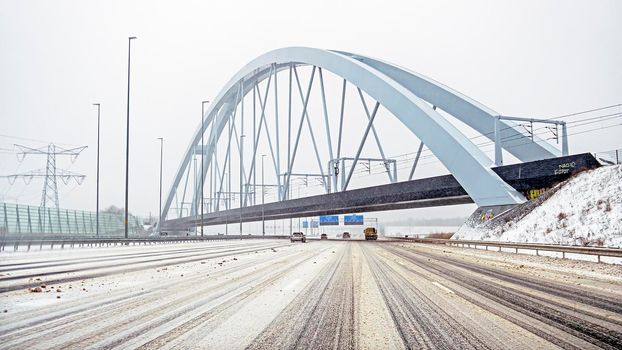 Snowy Zandhazen bridge near Muiderberg in the Netherlands in winter