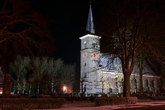 Snowy church from Ternaard in Friesland in the Netherlands at night