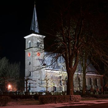 Snowy church from Ternaard in Friesland in the Netherlands at night