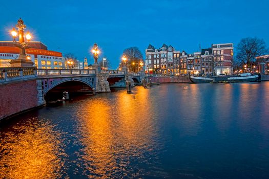 The Blauwbrug at the Amstel in Amsterdam the Netherlands at sunset