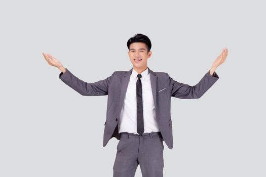Portrait businessman in suit standing with win success isolated on white background, young asian business man is manager or executive having confident and excited is positive, expression and emotion.