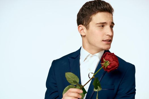 Business man in a flower suit romance date a gift. High quality photo