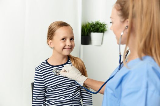 doctor with stethoscope check up a child hospital health. High quality photo