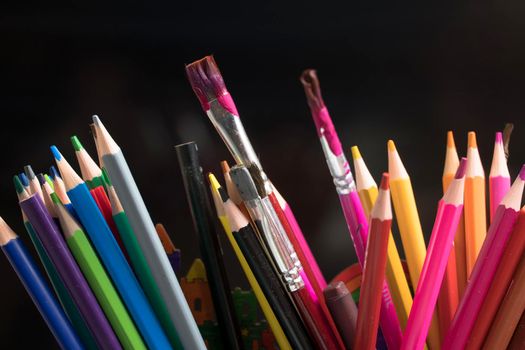 A set of colored pencils, stationery. Lots of colorful pencils on the table. Drawing and Visual Art Kits