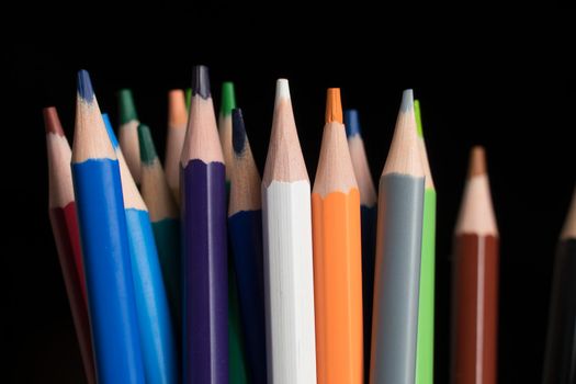 A set of colored pencils, stationery. Lots of colorful pencils on the table. Drawing and Visual Art Kits