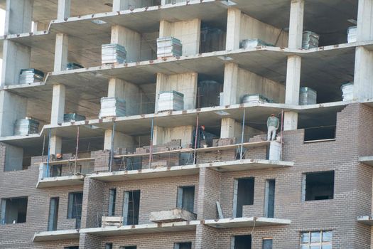 Construction of a multi-storey residential building. Pre-fabricated structures and products. The construction of a new building or skyscraper.