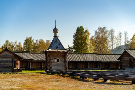 Natural landscape with wooden buildings. Irkutsk region, Taltsy