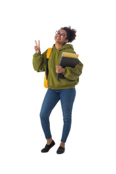 Friendly ethnic black female high school student in eyeglasses with backpack and composition book isolated on white background, full length portrait