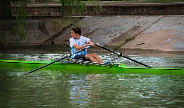 2021-02-11 - Young boy rowing on a boat in Mendoza, Argentina.