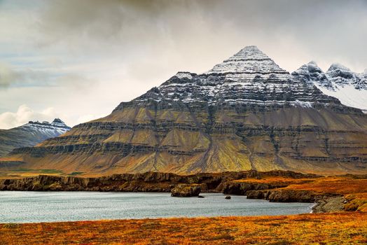 Mountain view in Stodvarfjordur on the east side of Iceland in a cloudy day