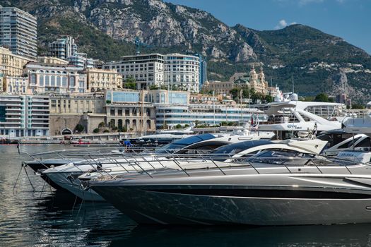 Monaco, Monte-Carlo, 06 August 2018: Tranquillity in port Hercules, is the parked boats, many yachts and boats, RIVA, Prince's Palace of Monaco, megayachts, massif of expensive real estate