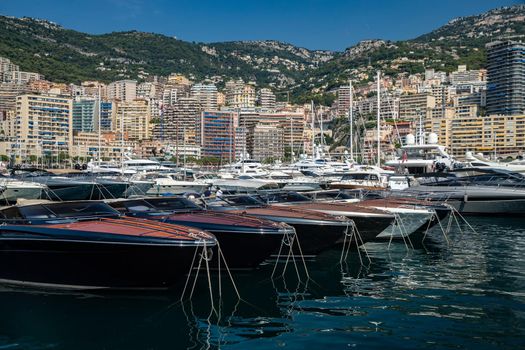 Monaco, Monte-Carlo, 06 August 2018: Tranquillity in port Hercules, is the parked boats, many yachts and boats, RIVA, Prince's Palace of Monaco, megayachts, massif of expensive real estate