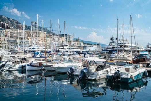 Monaco, Monte-Carlo, 06 August 2018: Tranquillity in port Hercules, is the parked boats, many yachts and boats, RIVA, Prince's Palace of Monaco, megayachts, massif of expensive real estate