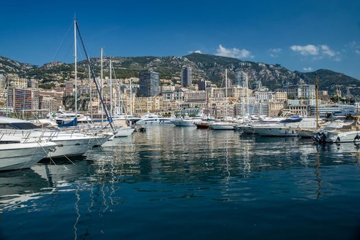 Monaco, Monte-Carlo, 06 August 2018: Tranquillity in port Hercules, is the parked boats, many yachts and boats, RIVA, Prince's Palace of Monaco, megayachts, massif of expensive real estate