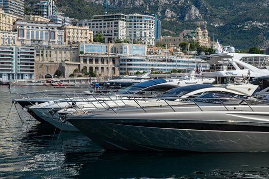 Monaco, Monte-Carlo, 06 August 2018: Tranquillity in port Hercules, is the parked boats, many yachts and boats, RIVA, Prince's Palace of Monaco, megayachts, massif of expensive real estate