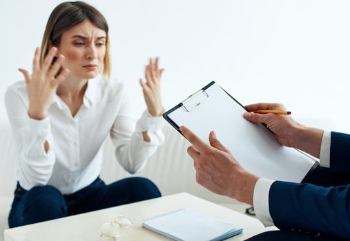 Employees men and women at the table communicating psychologist documents. High quality photo