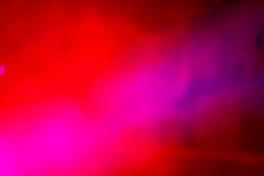 Red stage smoke with blue reflections.