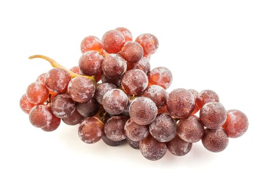 Ripe red grape. Pink bunch with leaves isolated on white.