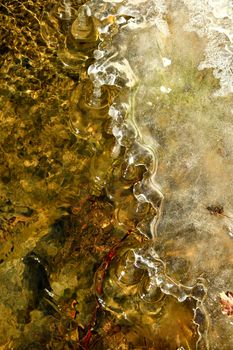 icicles at a creek shore