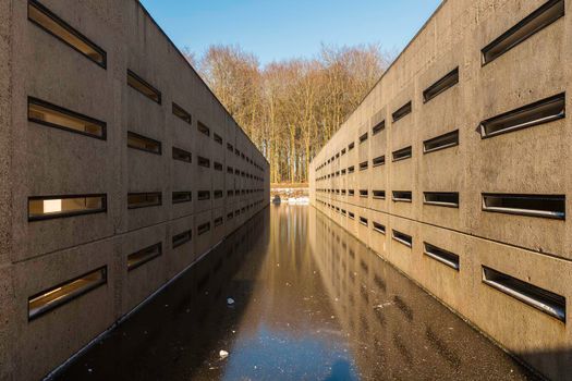 Concrete lab testing device in the middle of a artificial lake, was back in the days used for developing the Delta works in the sixties.