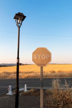 Sun-faded stop sign in southern spain