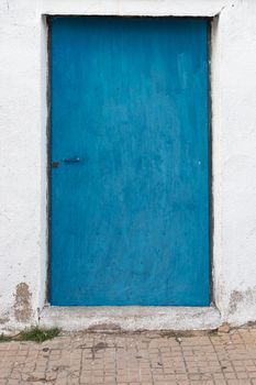 Blue painted door in southern Andalusia in spain