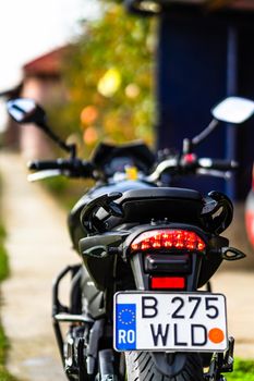 Detail of black motorcycle. Honda Hornet motorcycle detail photo in Bucharest, Romania, 2021