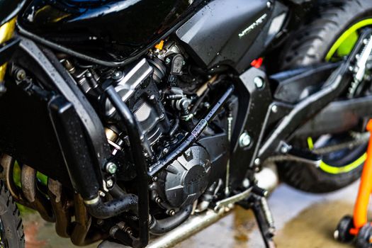 Detail of black motorcycle. Honda Hornet motorcycle detail photo in Bucharest, Romania, 2021