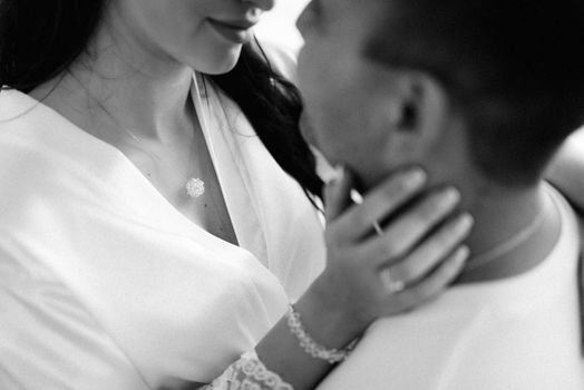 the bride and groom tenderly hold hands between them love and relationships