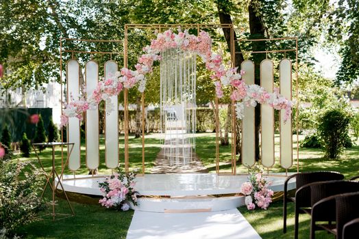 wedding ceremony in the woods among the trees on the green track