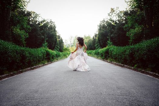 dress up the bride in a wedding dress with corset and lacing