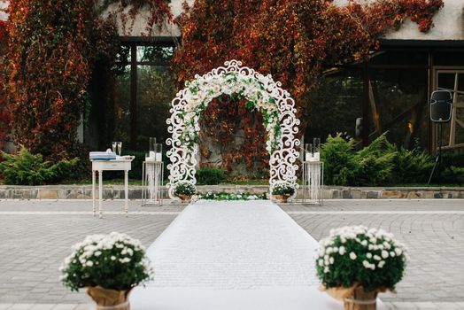 wedding ceremony in the woods among the trees on the green track