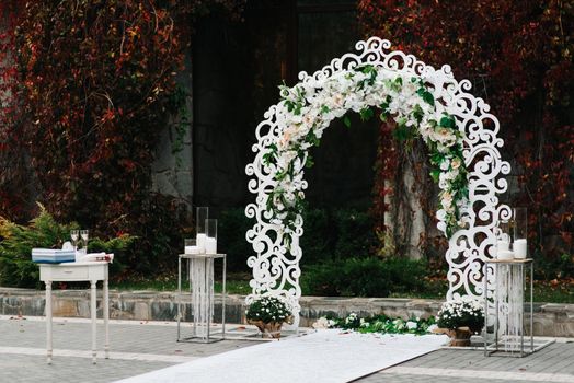 wedding ceremony in the woods among the trees on the green track