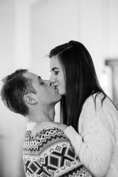 a guy and a girl celebrate the new year together
in a warm atmosphere and give each other gifts